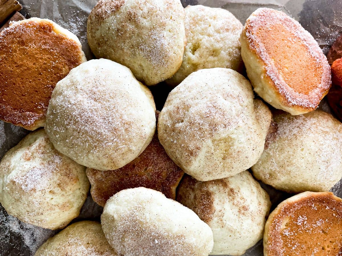 several buttermilk cookies laying on top of each other in a pile