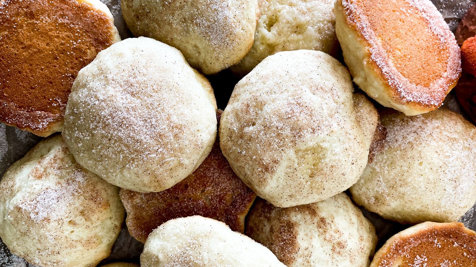 several buttermilk cookies laying on top of each other in a pile