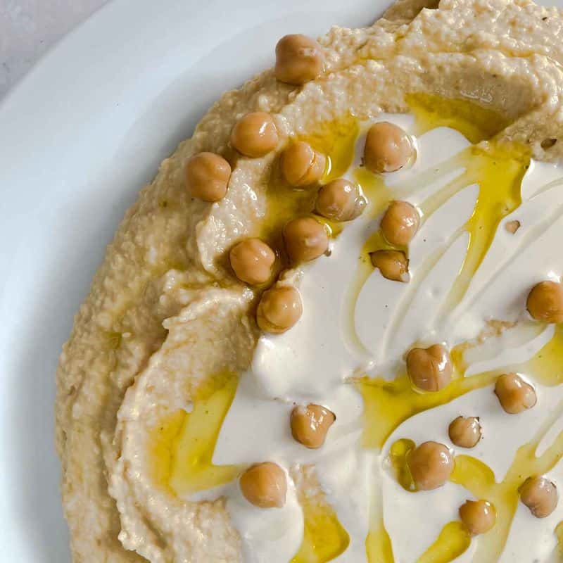 closeup of homemade hummus with tahini sauce