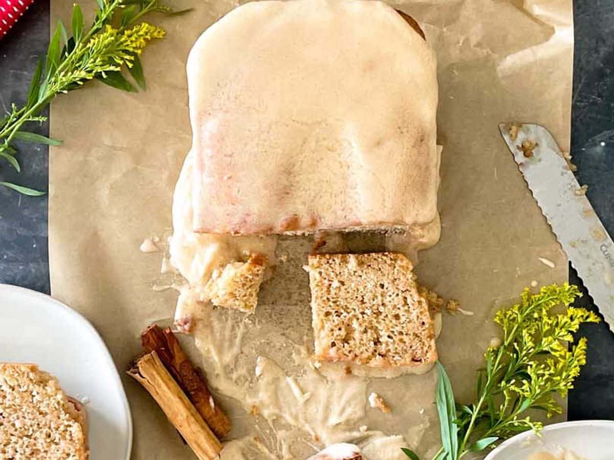loaf of apple cider donut bread with slice cut