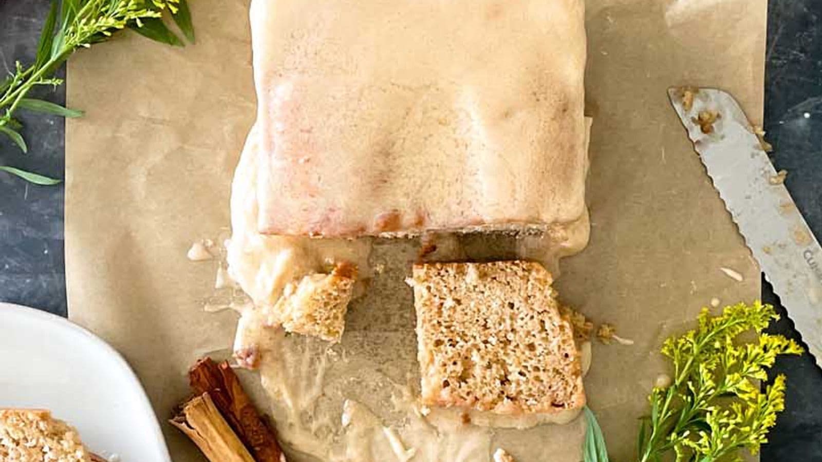 loaf of apple cider donut bread with slice cut