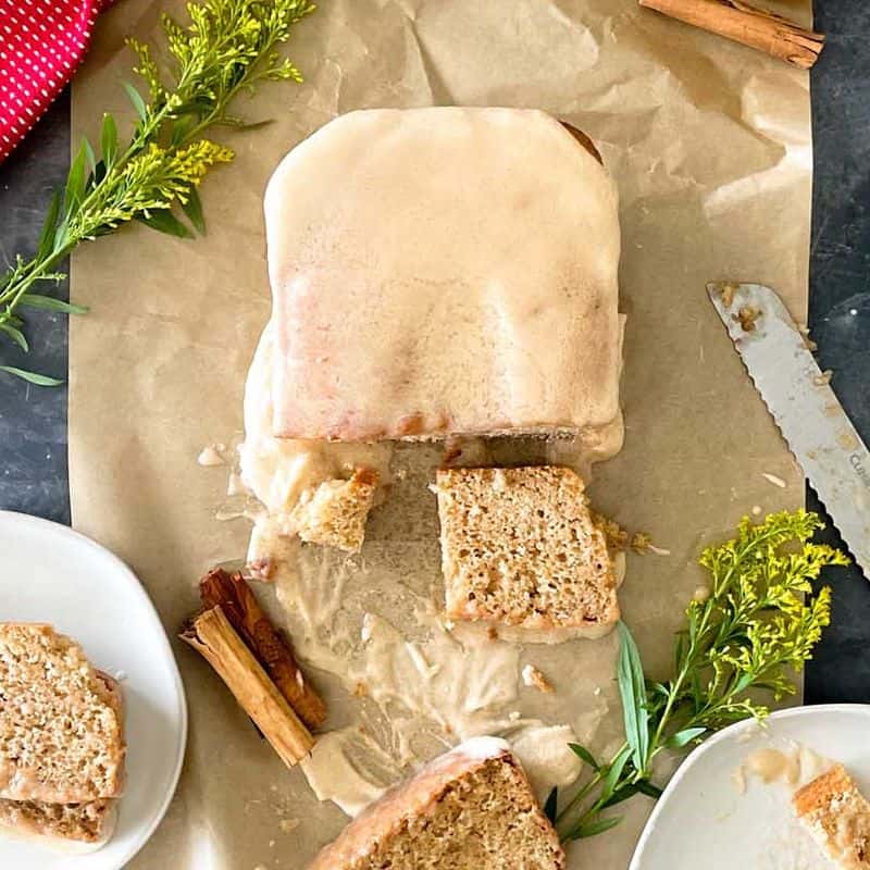 loaf of apple cider donut bread with slice cut