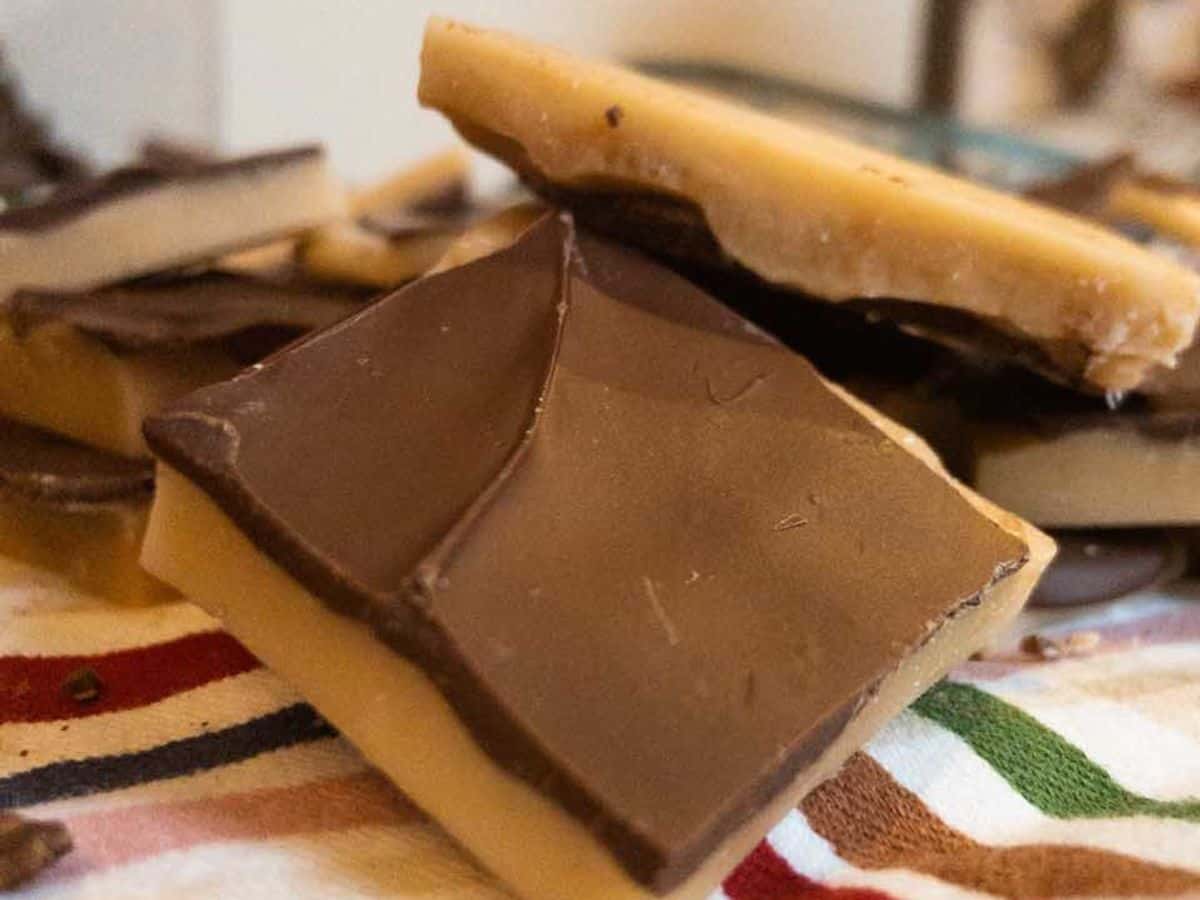 pieces of buttercrunch on a dish towel on the counter