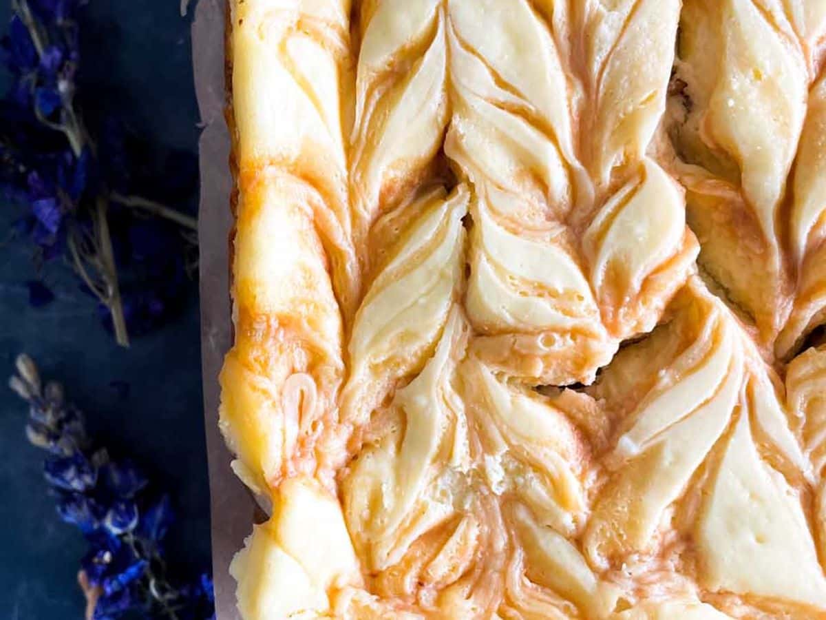 caramel cashew cheesecake bars from top showing swirl pattern
