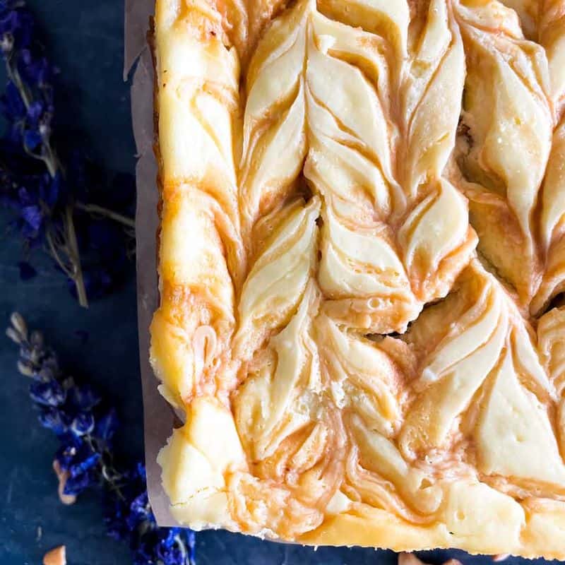 caramel cashew cheesecake bars from top showing swirl pattern
