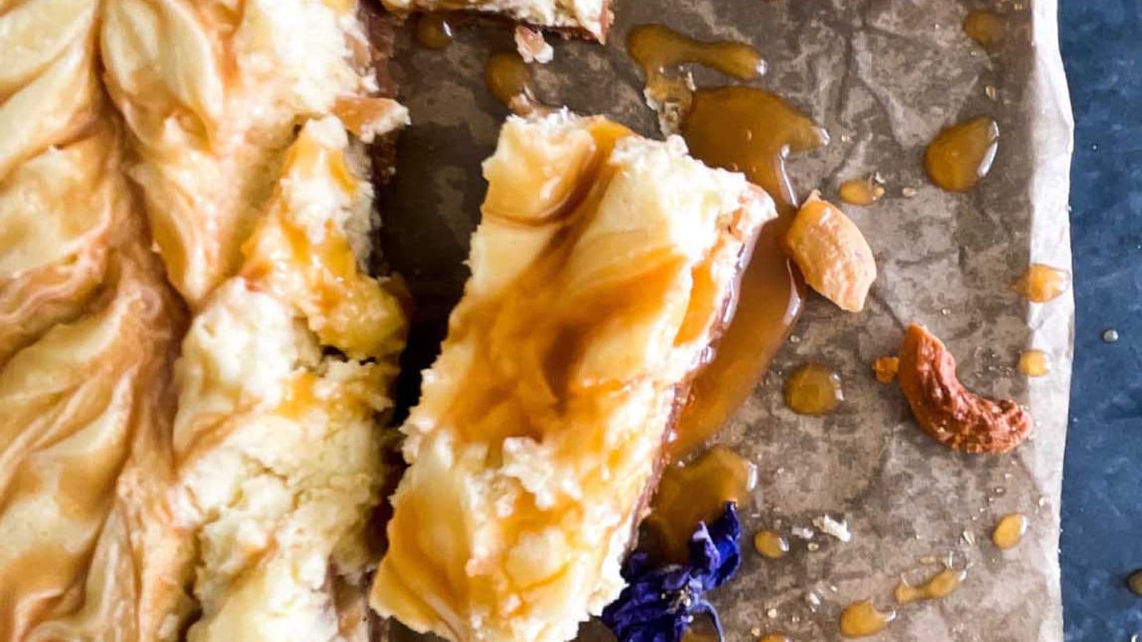 caramel cashew cheesecake cut into bars
