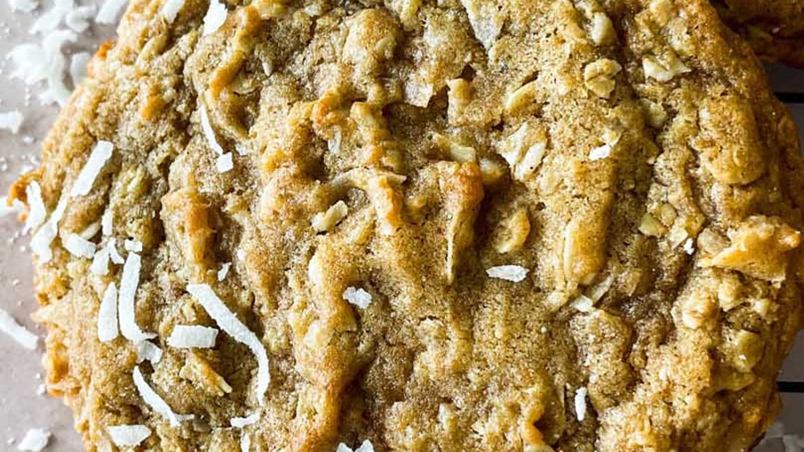 closeup of spiced coconut cookie with pieces of shredded coconut