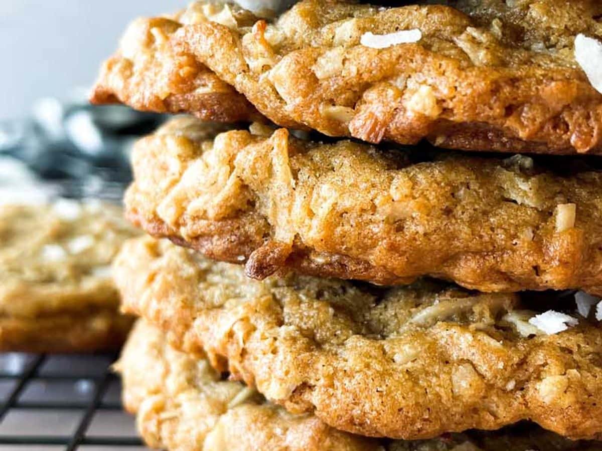 five coconut spiced cookies stacked on top of each other