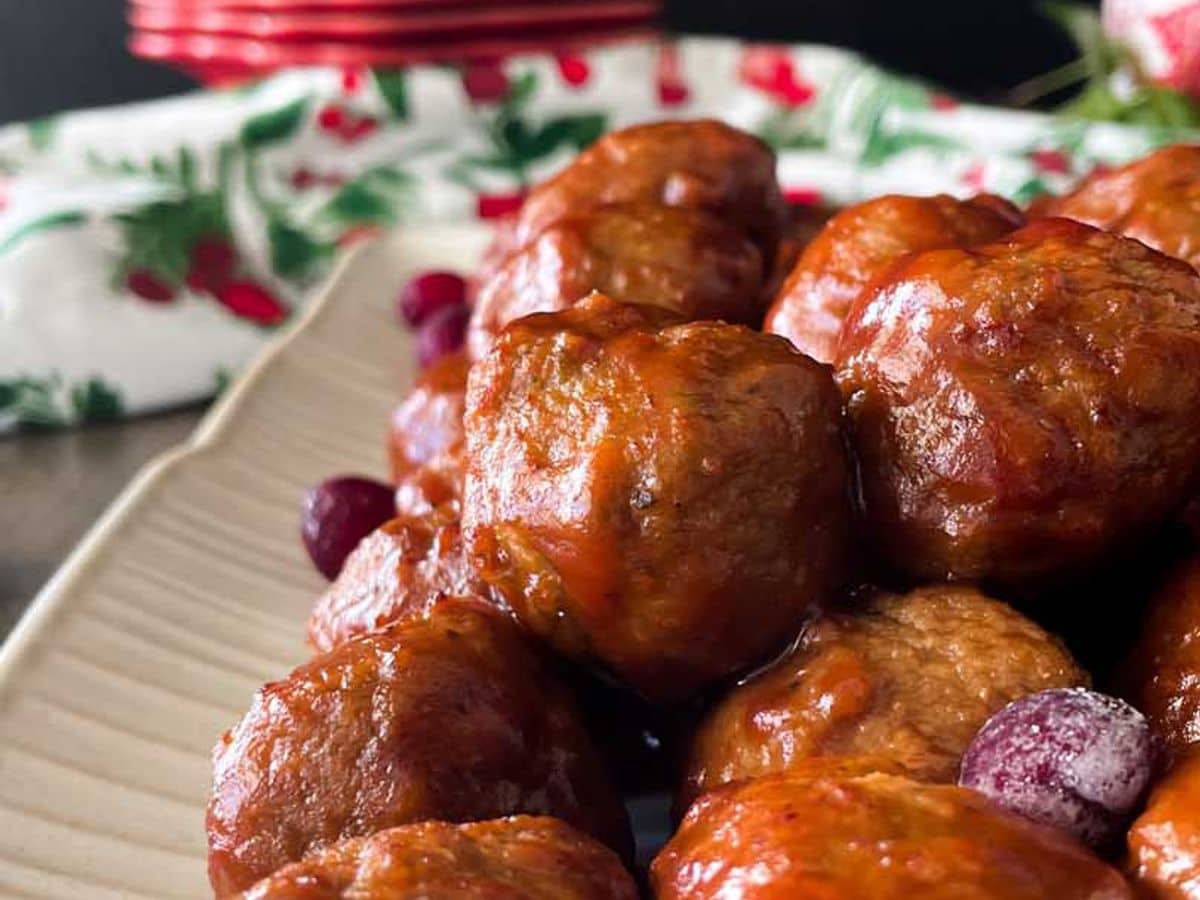 side view of meatballs in tangy cranberry sauce