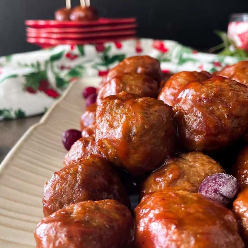 side view of meatballs in tangy cranberry sauce