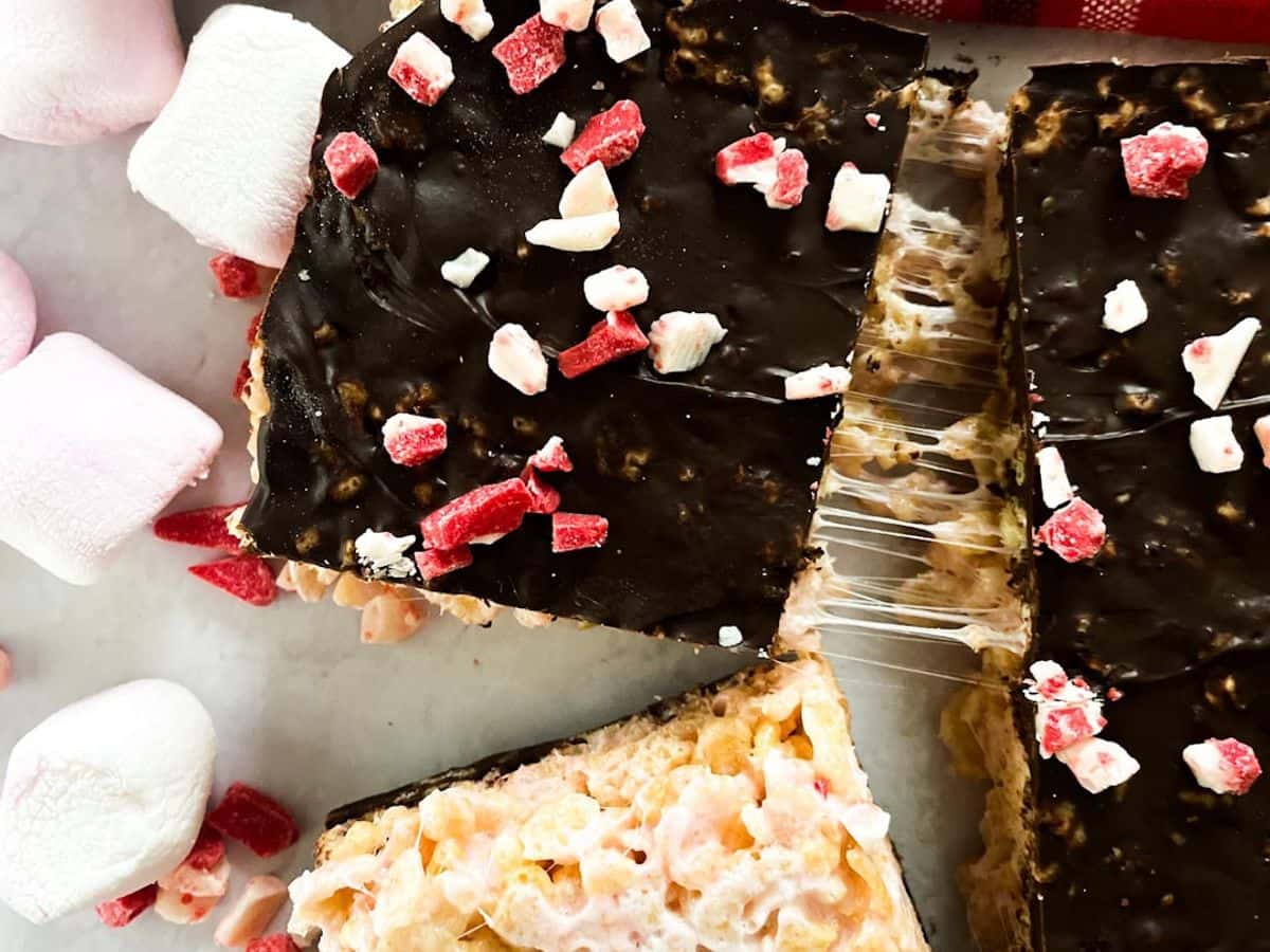 dark chocolate peppermint rice krispie treats with one flipped over to show marshmallow side