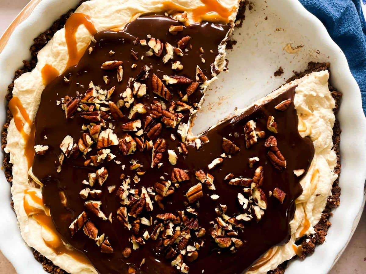 frozen peanut butter caramel pie with a slice missing
