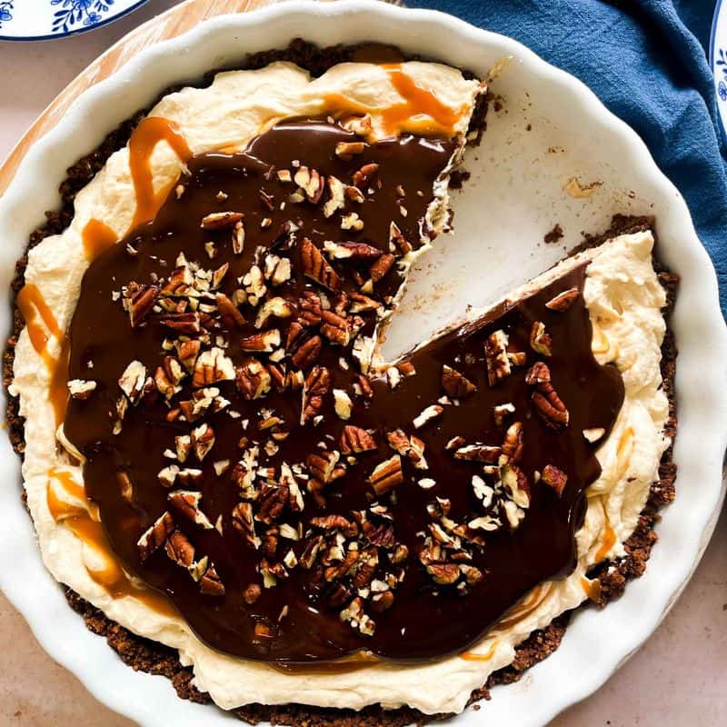frozen peanut butter caramel pie with a slice missing