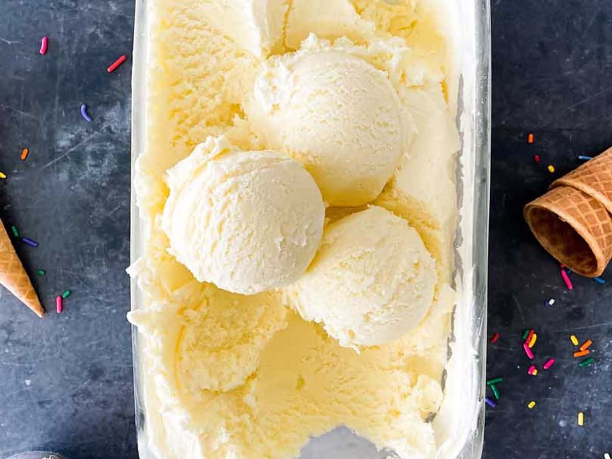 three scoops of homemade vanilla frozen custard in the container