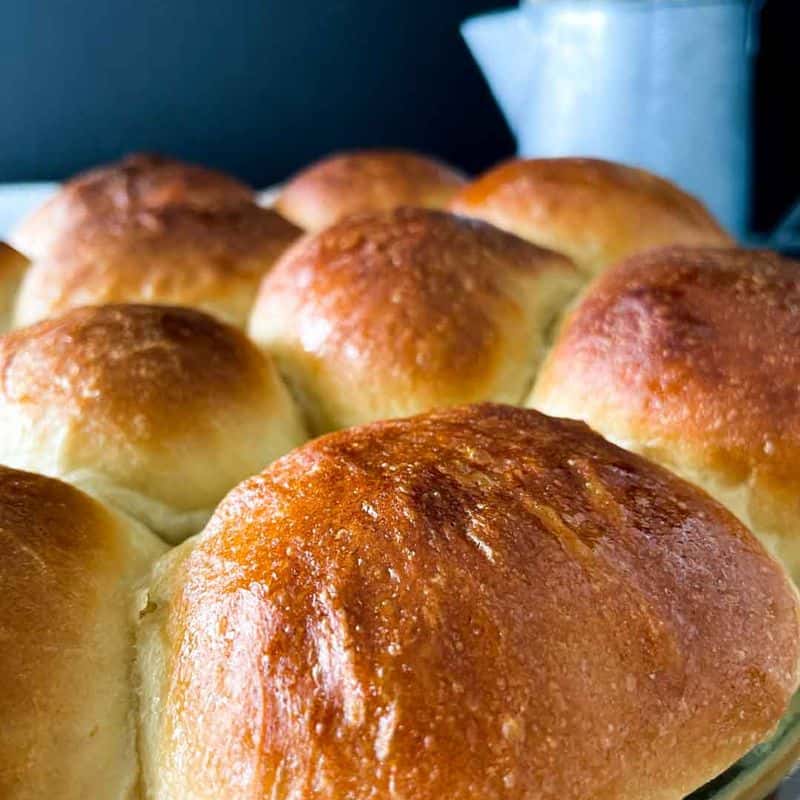 closeup of honey yeast rolls in pan