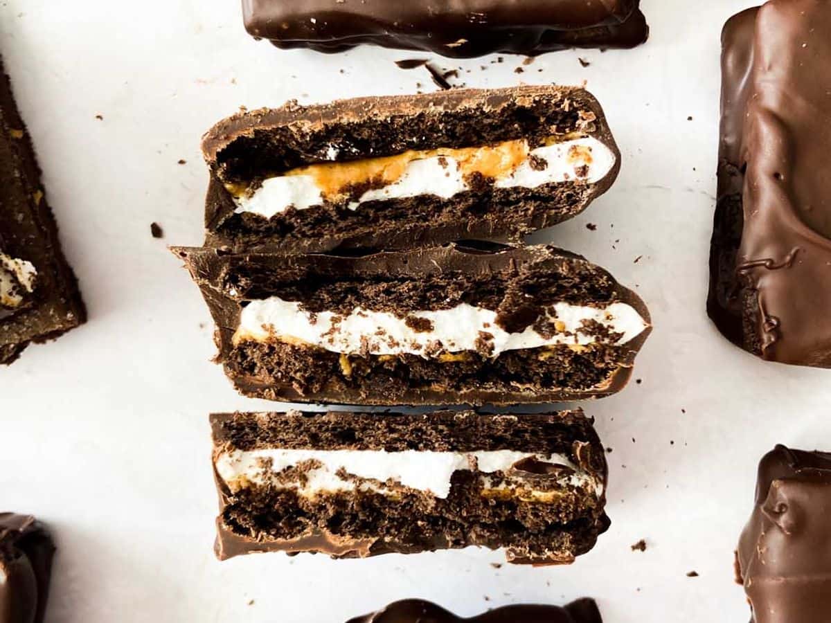 peanut butter smores bars broken and set up next to each other to show the filling inside