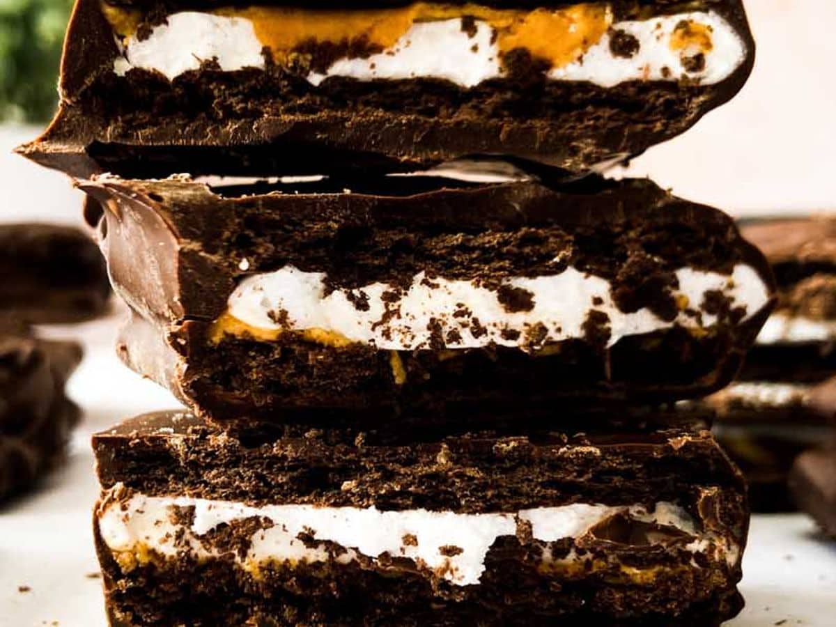 peanut butter smores bars broken in half and stacked on top of each other