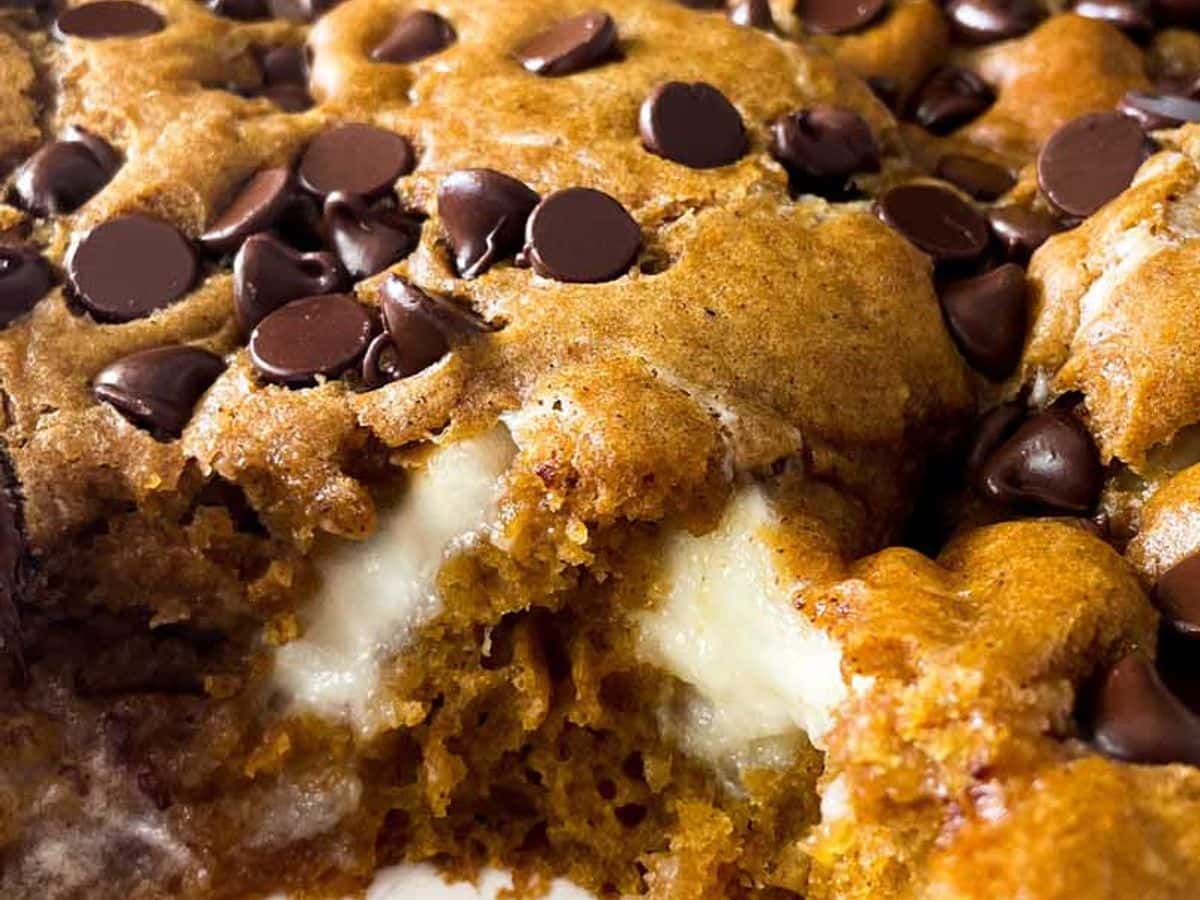close up of pumpkin cake with cream cheese filling and chocolate chips