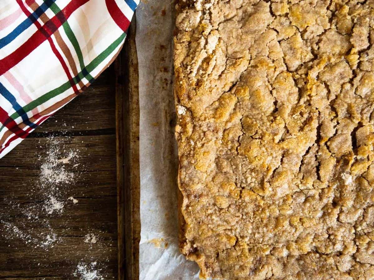 pumpkin pie cake finished and uncut showing crispy streusel topping