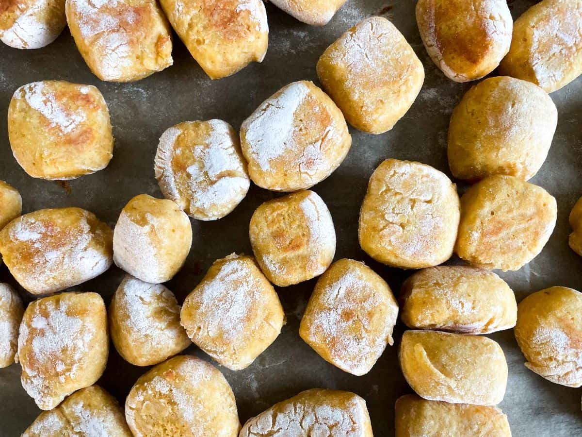 pan of cooked pumpkin pretzel bites before being dipped in cinnamon sugar