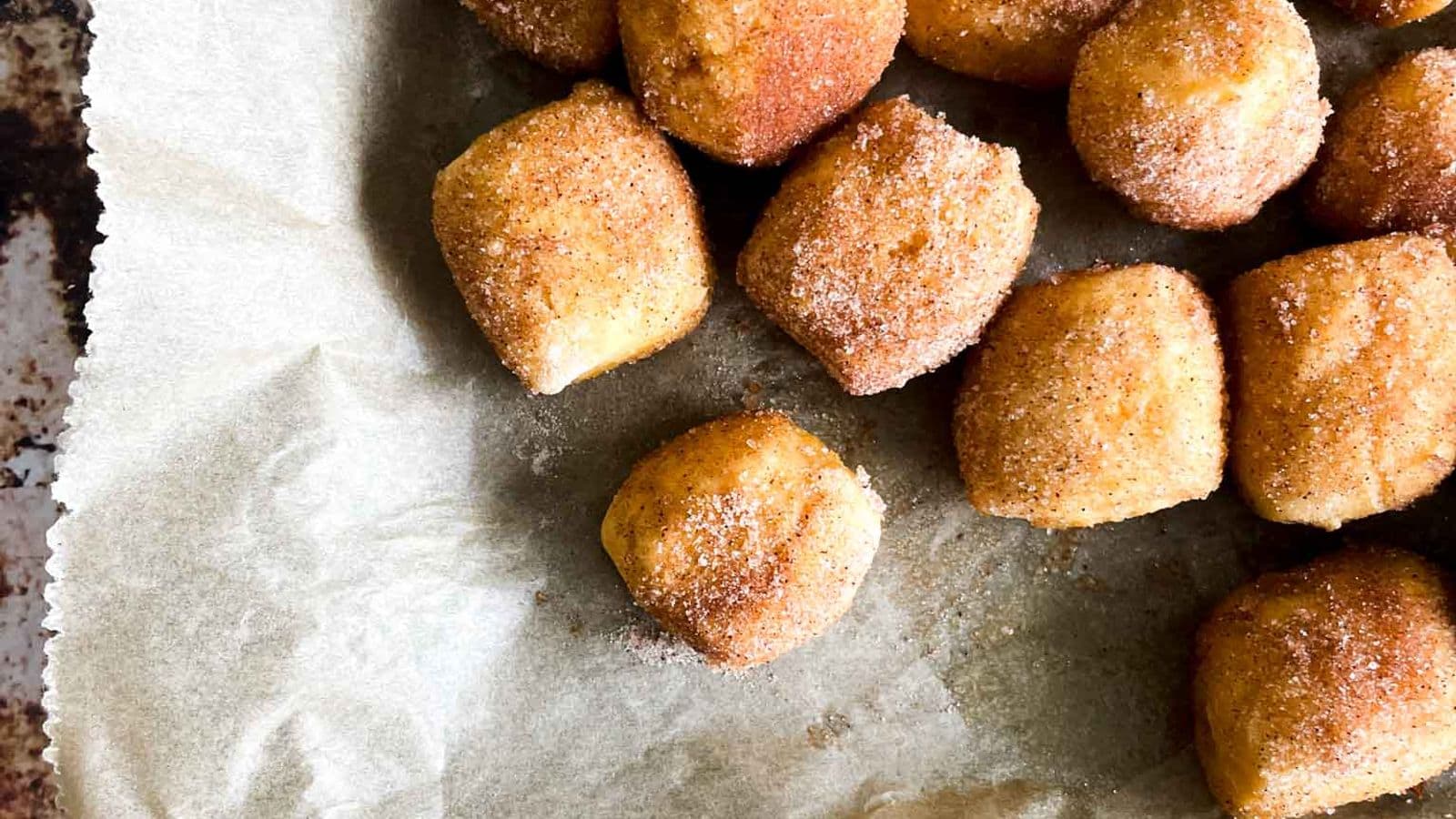 pan of pumpkin pretzel bites coated in cinnamon sugar
