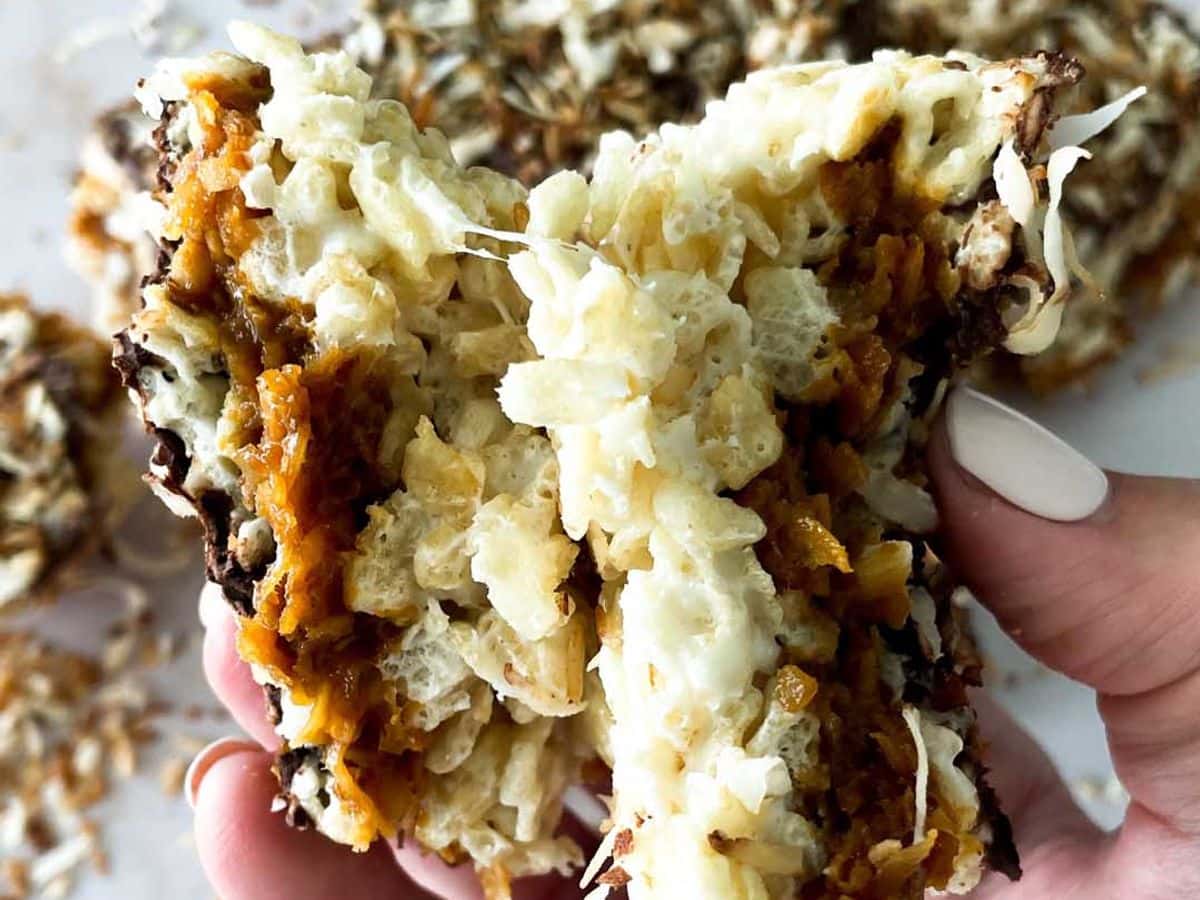 samoa rice krispy treat pulled apart and held in one hand