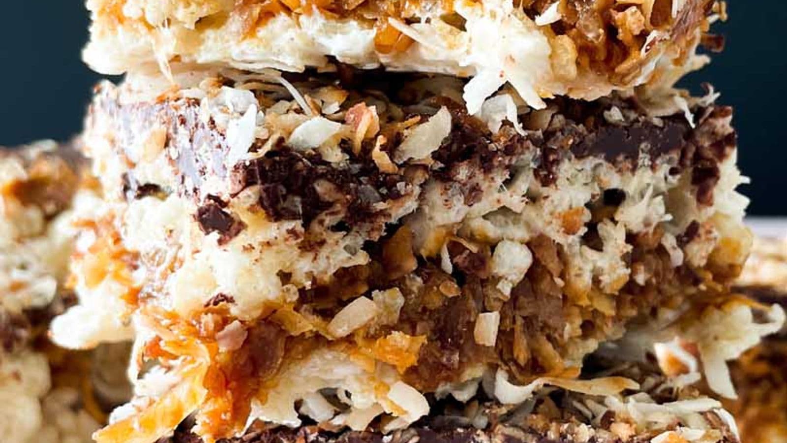 stack of samoa rice krispy treats with flakes of toasted coconut