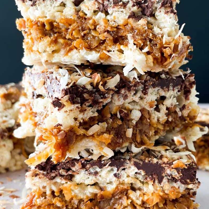 stack of samoa rice krispy treats with flakes of toasted coconut