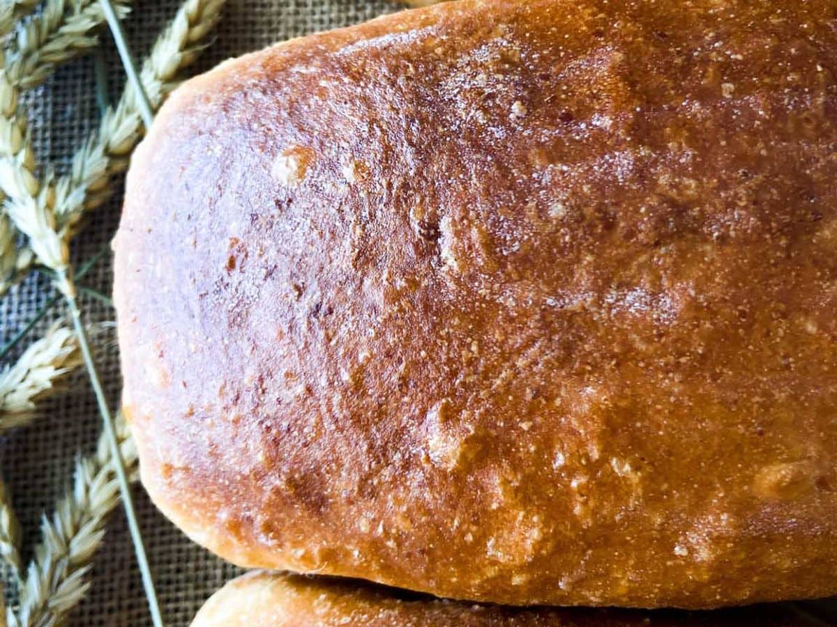 three whole sourdough bread loaves with golden brown crust