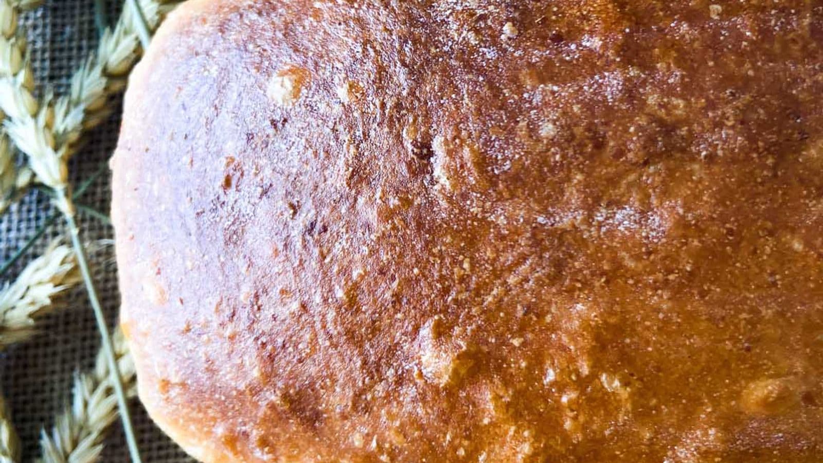 three whole sourdough bread loaves with golden brown crust