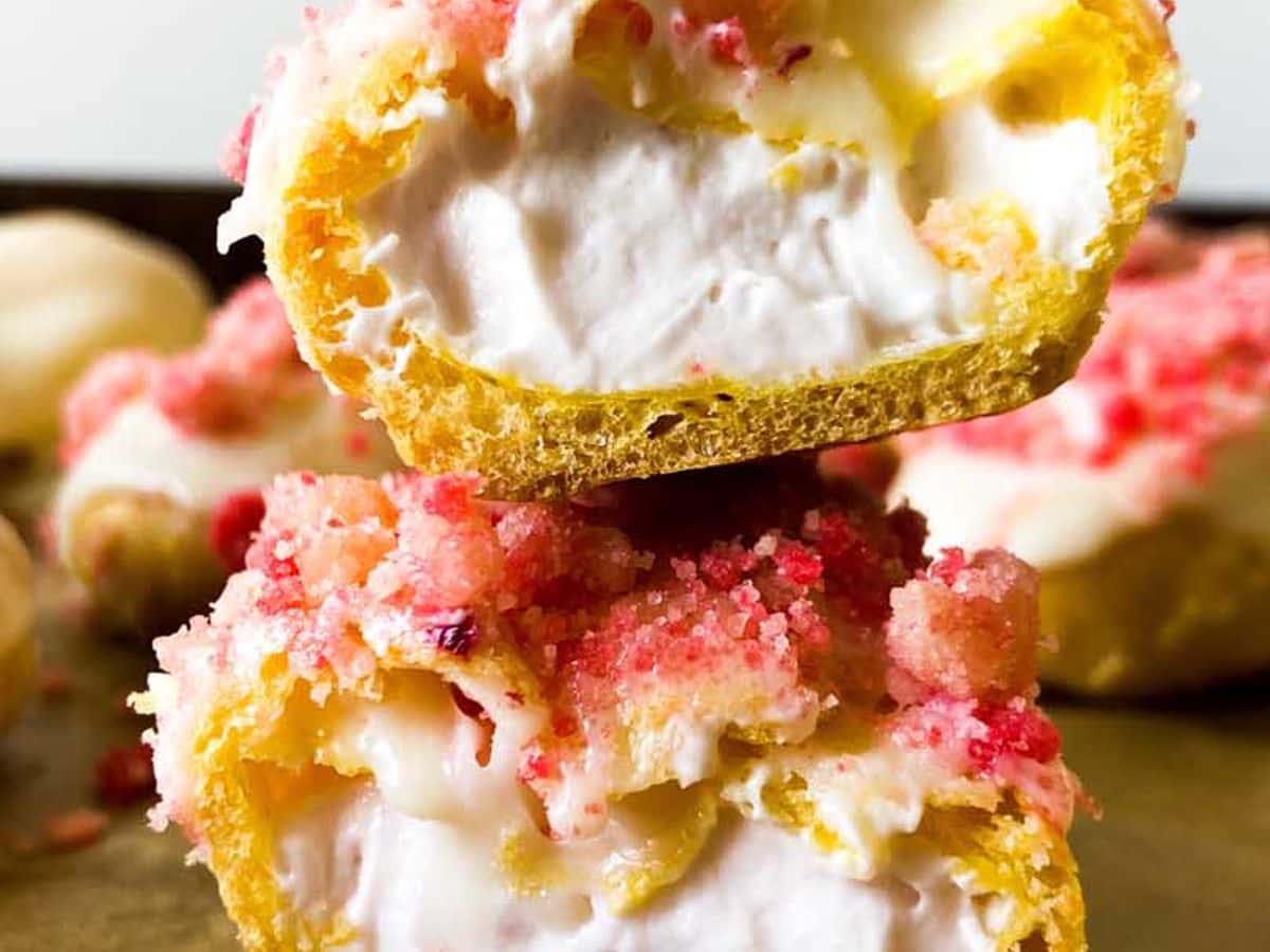 strawberry eclairs cut in half and stacked to show filling inside