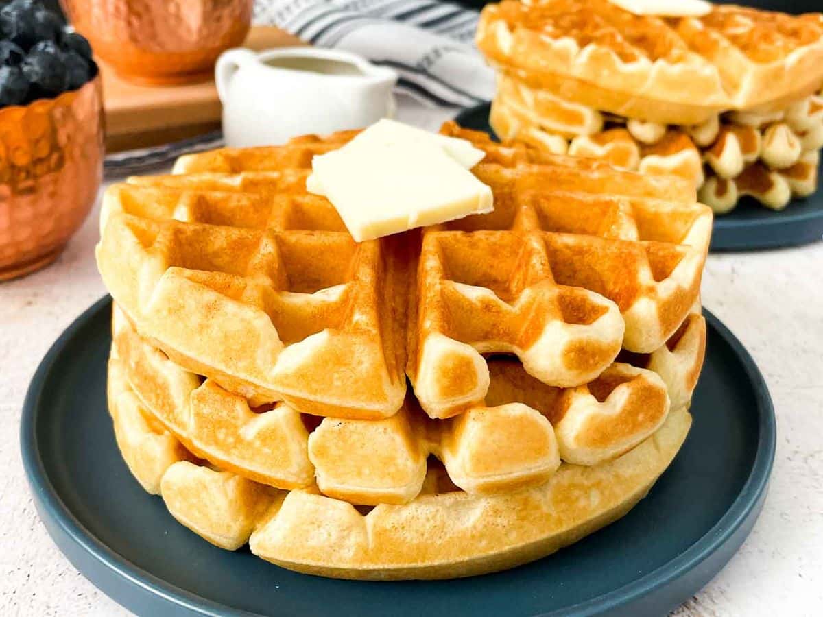 A stack of homemade waffles ready to serve