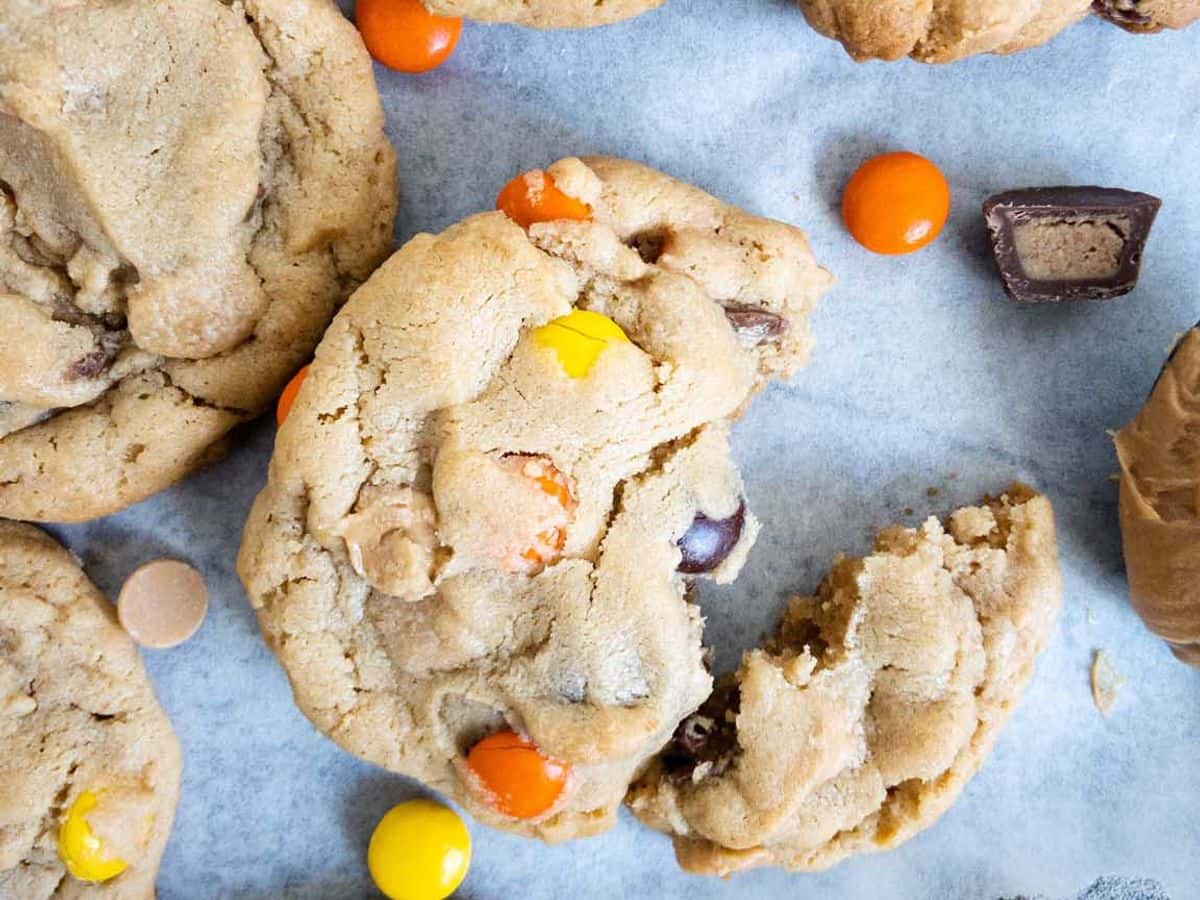 peanut butter cookie broken with Reese's pieces, mini Reese's cups, and peanut butter chips